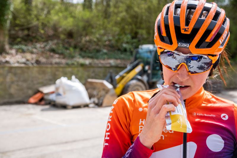Cyclist getting ready for a race eating a fastfood gummy